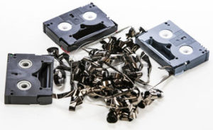 24069692-broken-video-tapes-in-a-pile-on-white